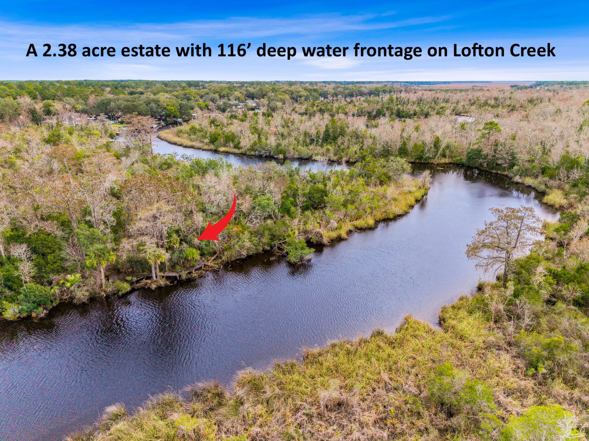 Located on a 2.38 acre estate directly on Lofton Creek...