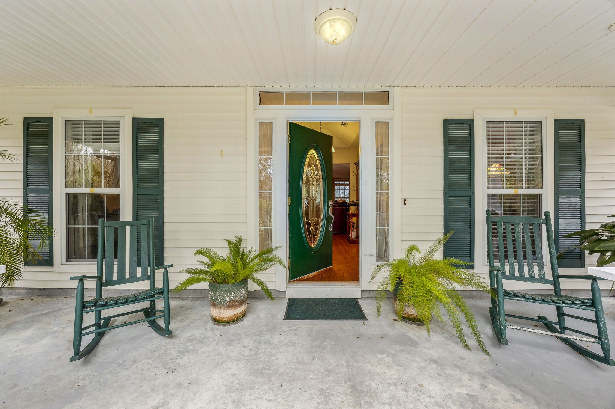 Enjoy a broad, welcoming front porch designed for shade and outdoor living