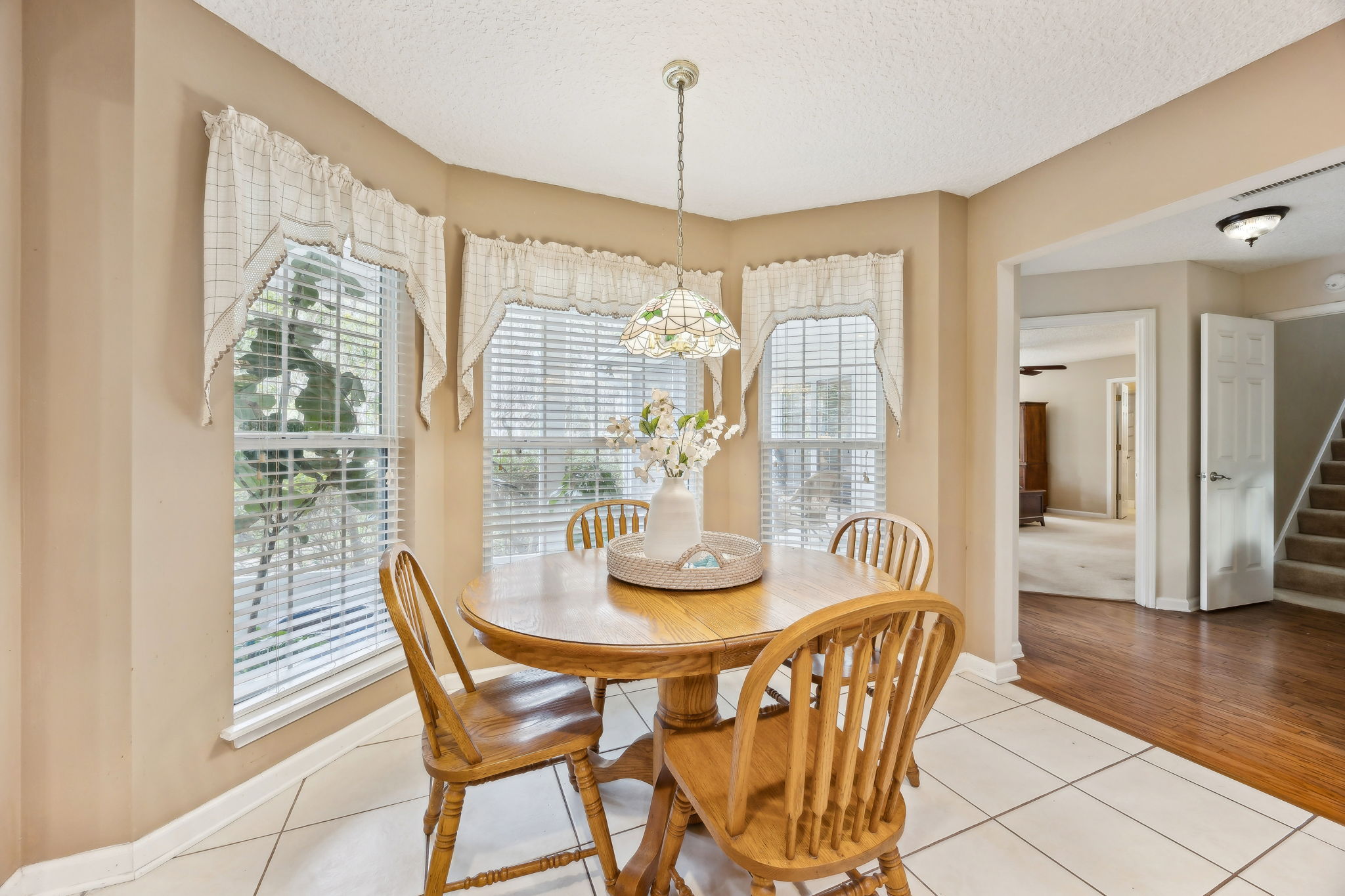 Connected to the kitchen is a bright and cheery breakfast nook.
