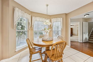 Connected to the kitchen is a bright and cheery breakfast nook.