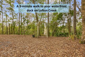 A wooded cleared path beckons in the back yard ...