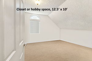 ... along with a large adjoining storage room that can serve as a closet or hobby space.