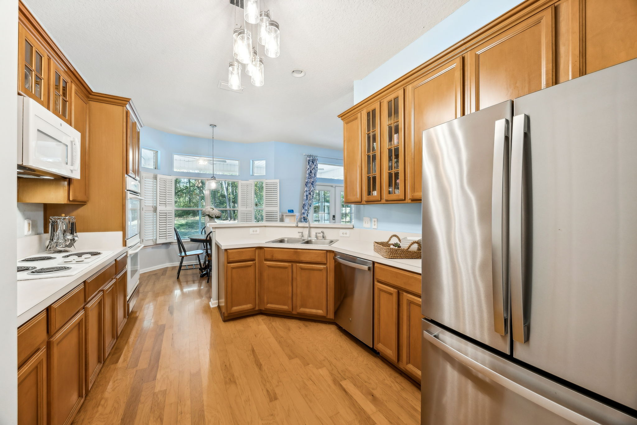 ... and a large double-oven kitchen with solid wood cabinets ...