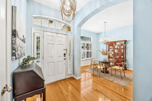 ... with honey- colored hardwood floors throughout all common areas and the master suite ...