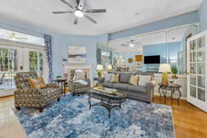 French doors provide a graceful, light-filled entry into the family room ...