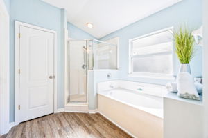 ... with walk-in shower and garden tub.