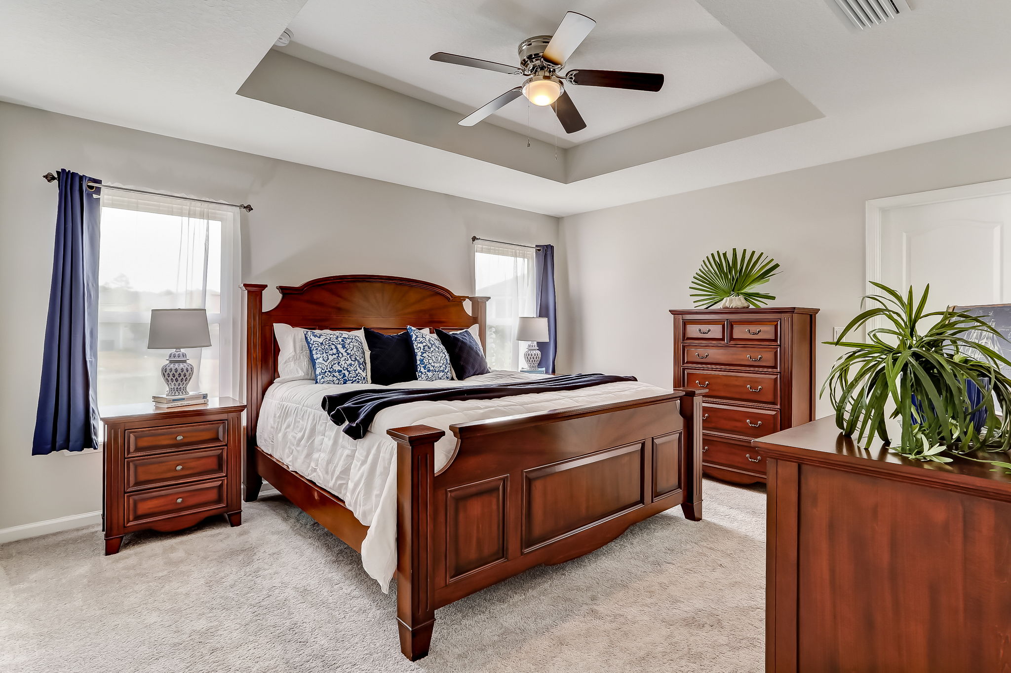 Roomy master suite features double windows and tray ceiling