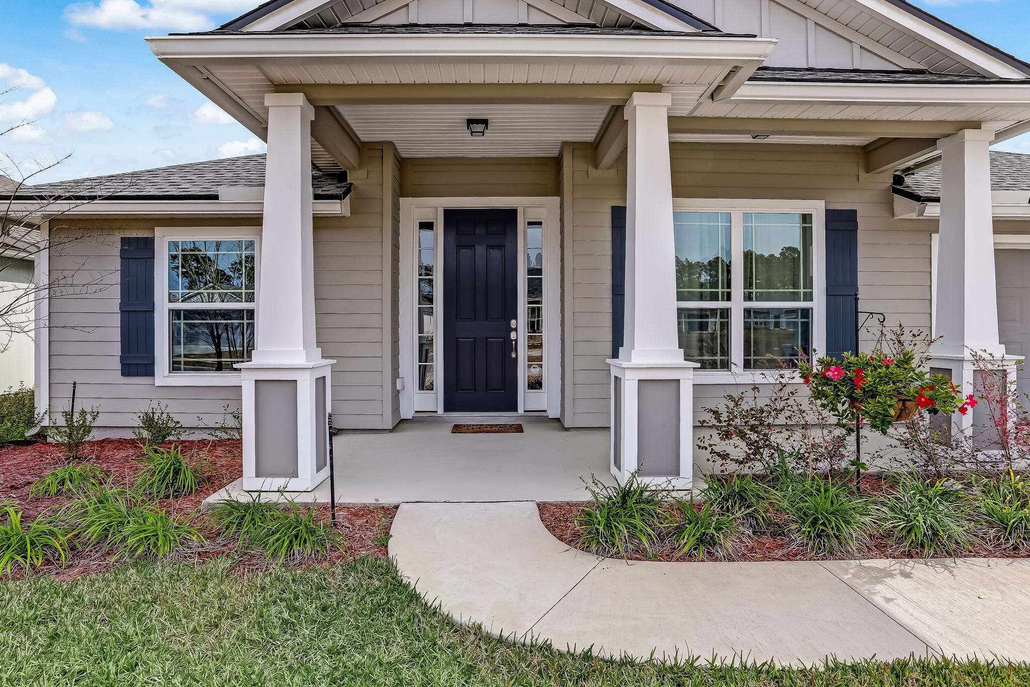 Covered front porch and varied roof lines add architectural beauty