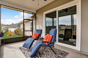 A screened  porch  provides outdoor living space ...