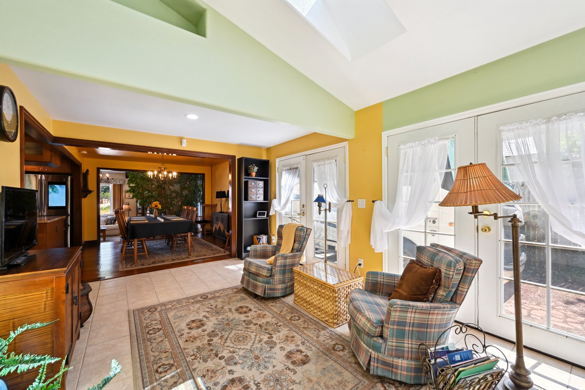 Large transition space to the sunroom makes a perfect little nook to relax and decompress