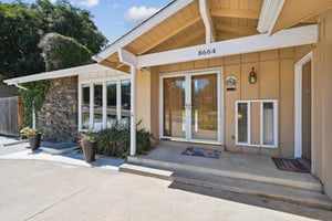 Front porch has private entry for lower level/basement.