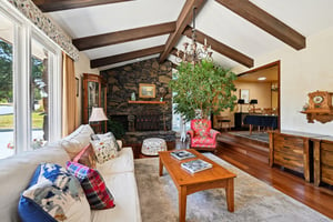 Sunken front room has charm and elegance with a wood stove fireplace!