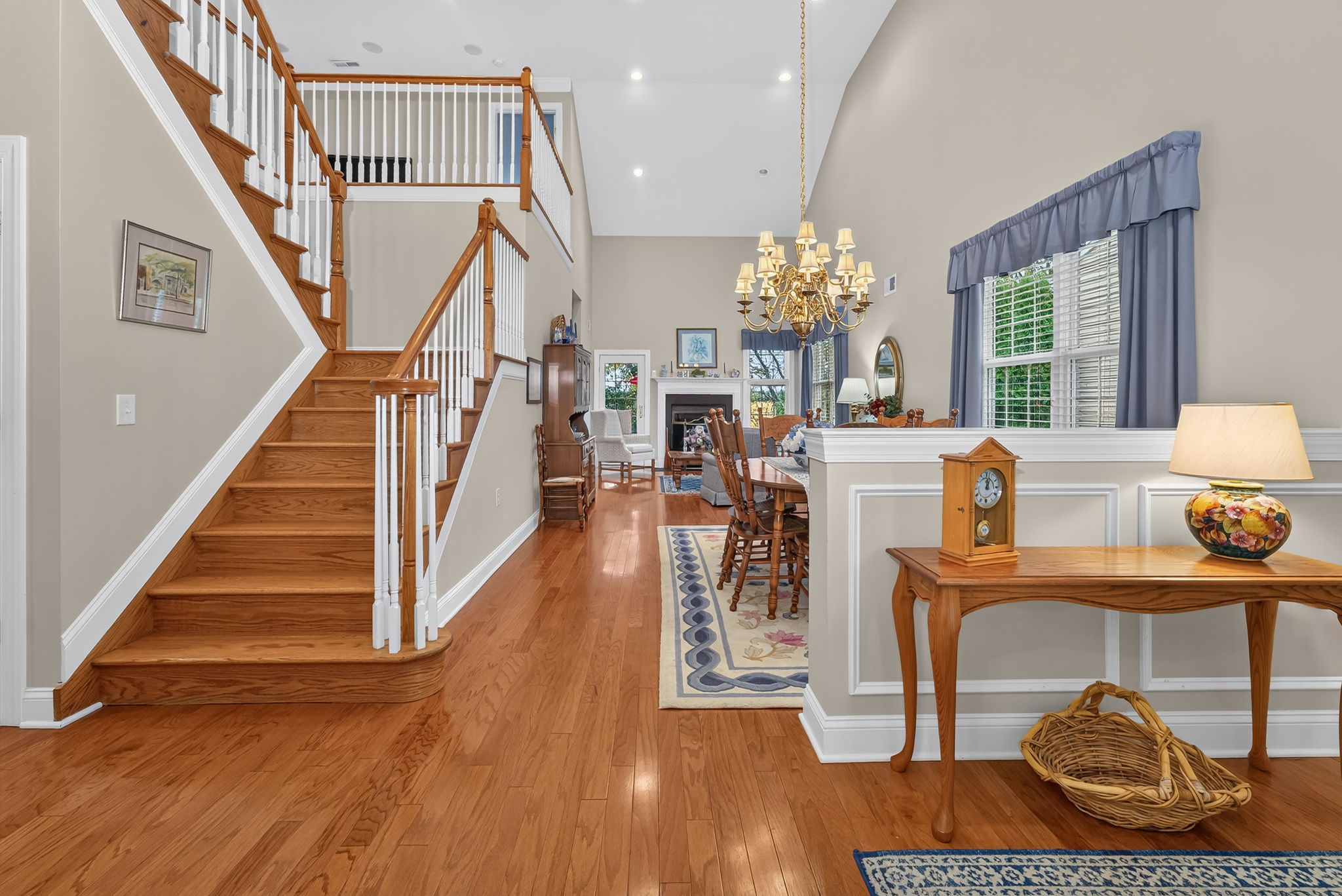 Chair rail and box mouldings enhance the foyer. Rich hardwood flooring extends throughout the main level.