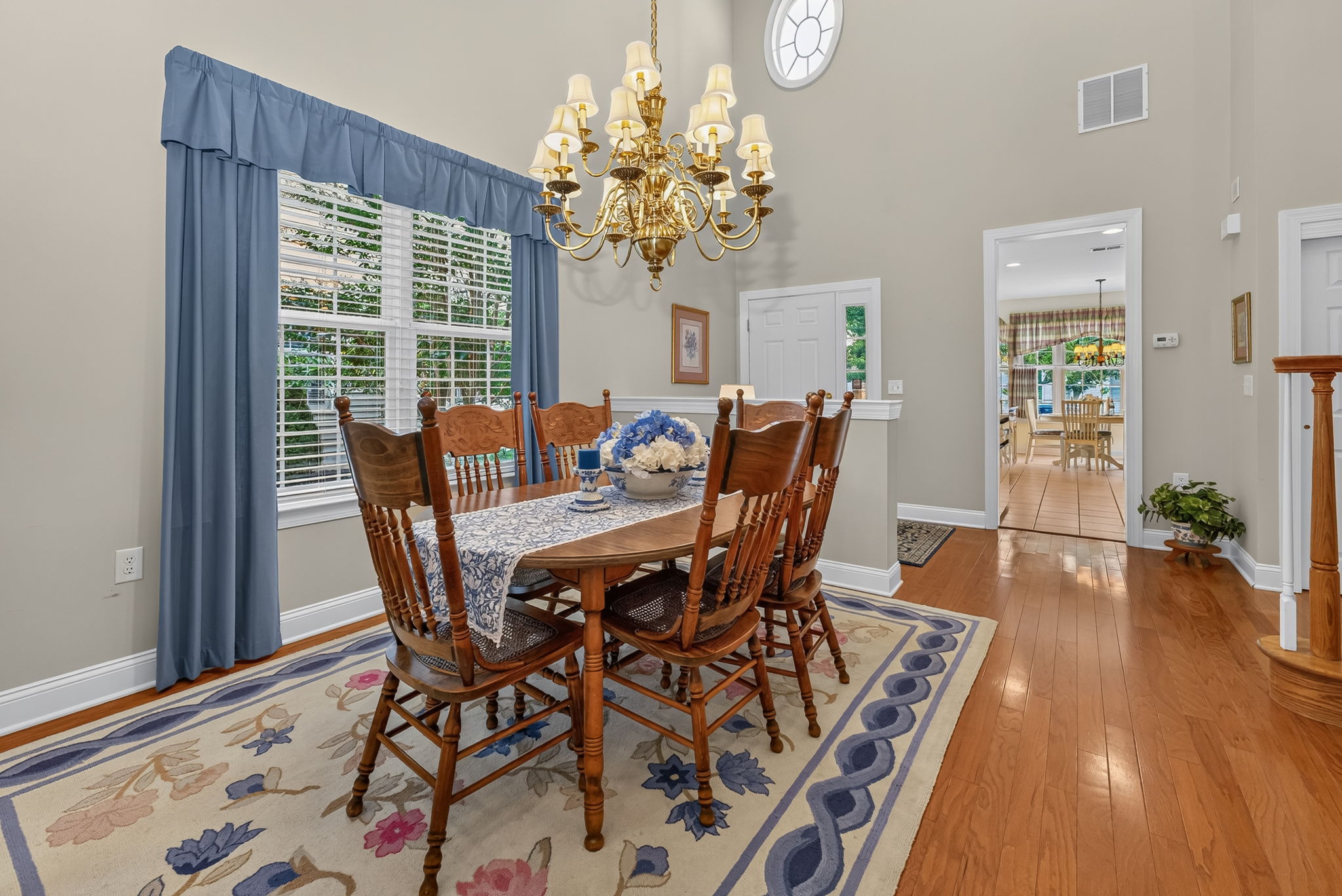 TWO STORY DINING ROOM The open-concept living and dining rooms are ideal for entertaining,
