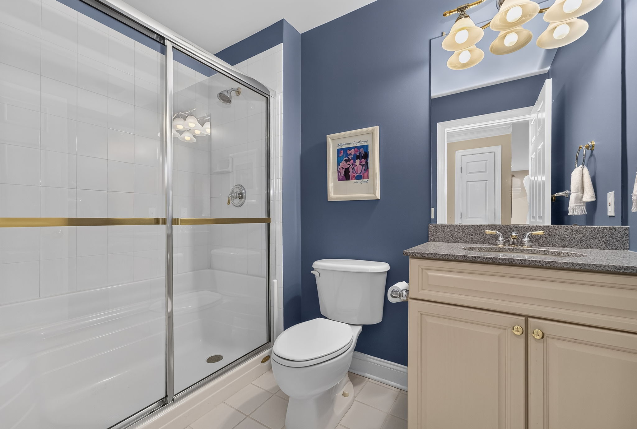 FULL BATH Upgraded vanity with granite top, seated shower in ceramic tile surround, ceramic tile flooring.