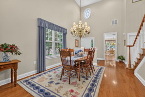 TWO STORY DINING ROOM The open-concept living and dining rooms are ideal for entertaining,