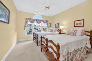 BEDROOM 3 Ceiling fan, double slider closet, and carpeting