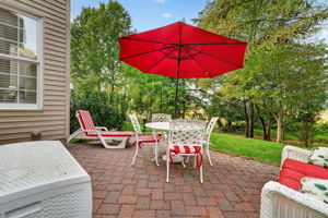PATIO The paver patio overlooks a peaceful backdrop of mature trees and open green space.