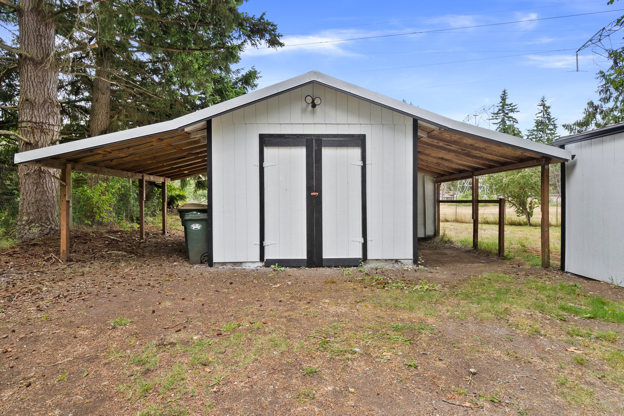 Exterior shed with side covering.