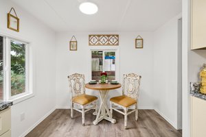 Cozy eating nook and pantry for storage.