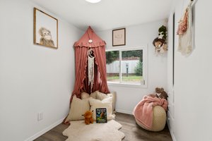Second bedroom with charming built-in shelf storage and second closet.