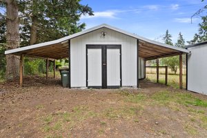 Exterior shed with side covering.