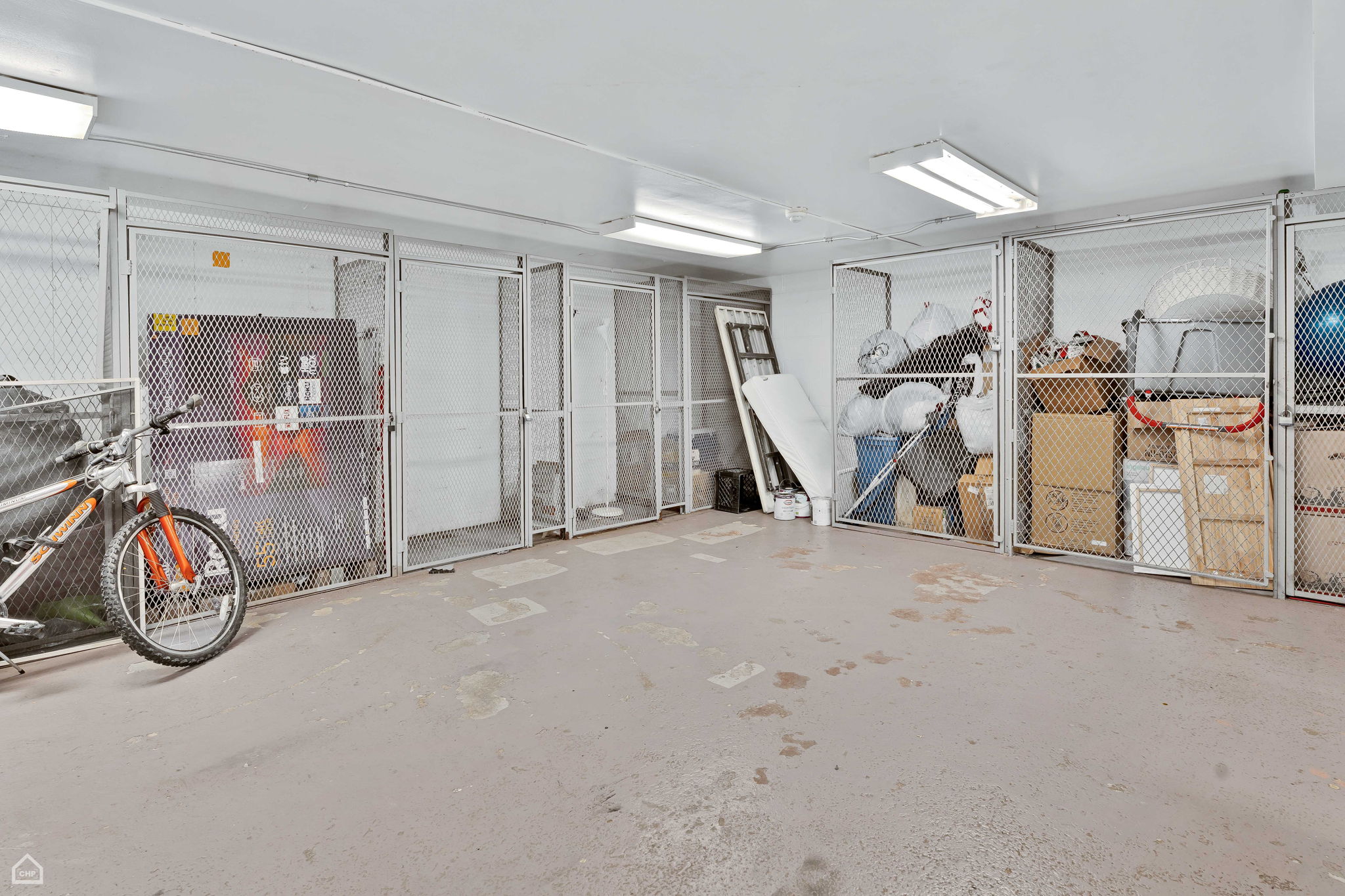 Large lockable storage locker in basement, informal bike storage