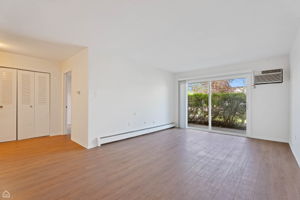 Open and sunny living room, foyer with large coat closet welcomes you