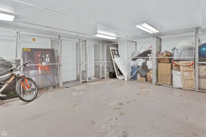 Large lockable storage locker in basement, informal bike storage