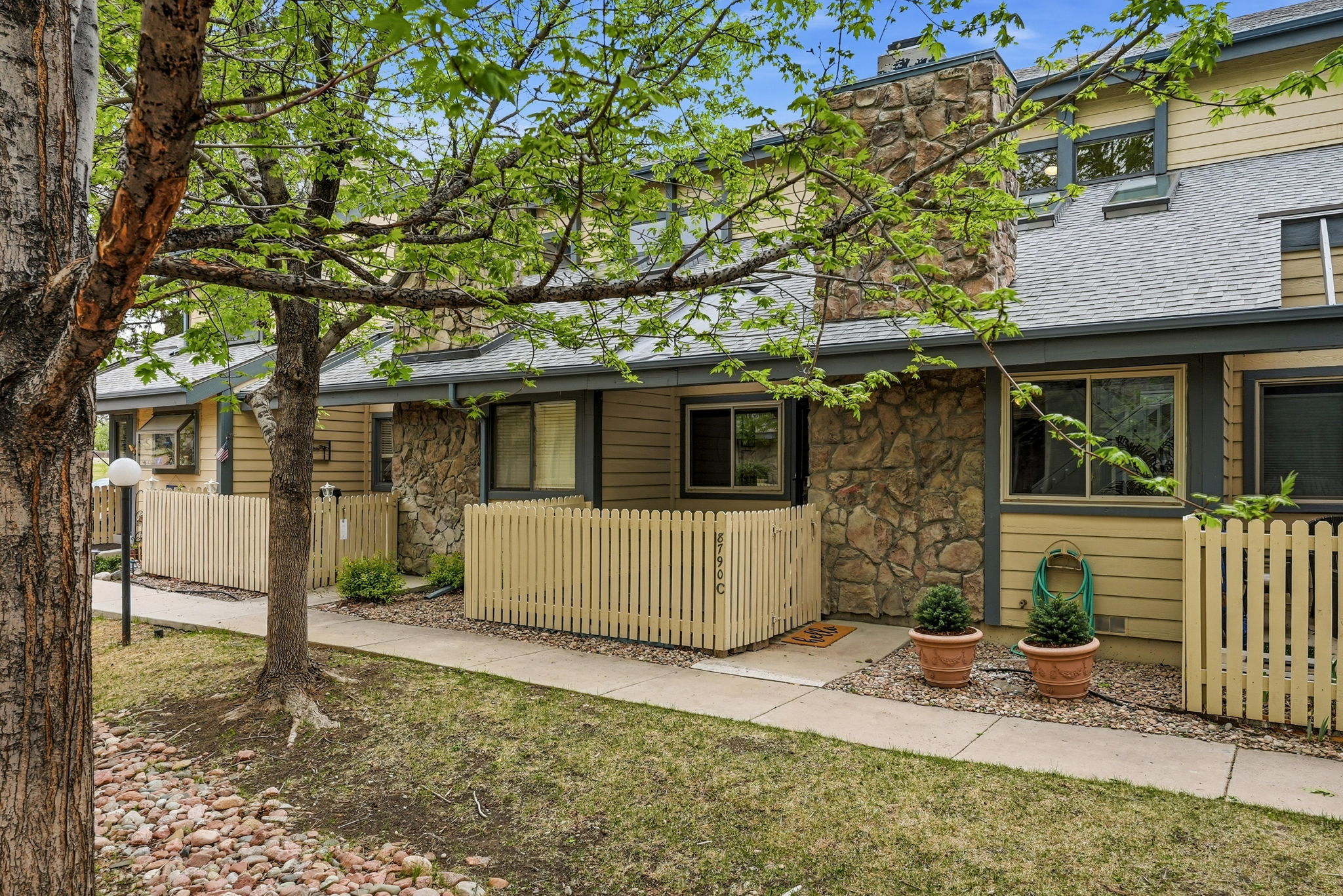 Main Entrance with Fenced Patio in Beautiful Courtyard