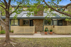 Main Entrance with Fenced Patio in Beautiful Courtyard
