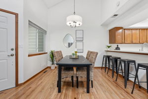 Dining Room with Real Hardwood Floors, Kitchen with Bar Seating and New Paint Throughout