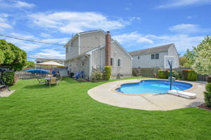 Alternate view of yard with kidney shaped pool