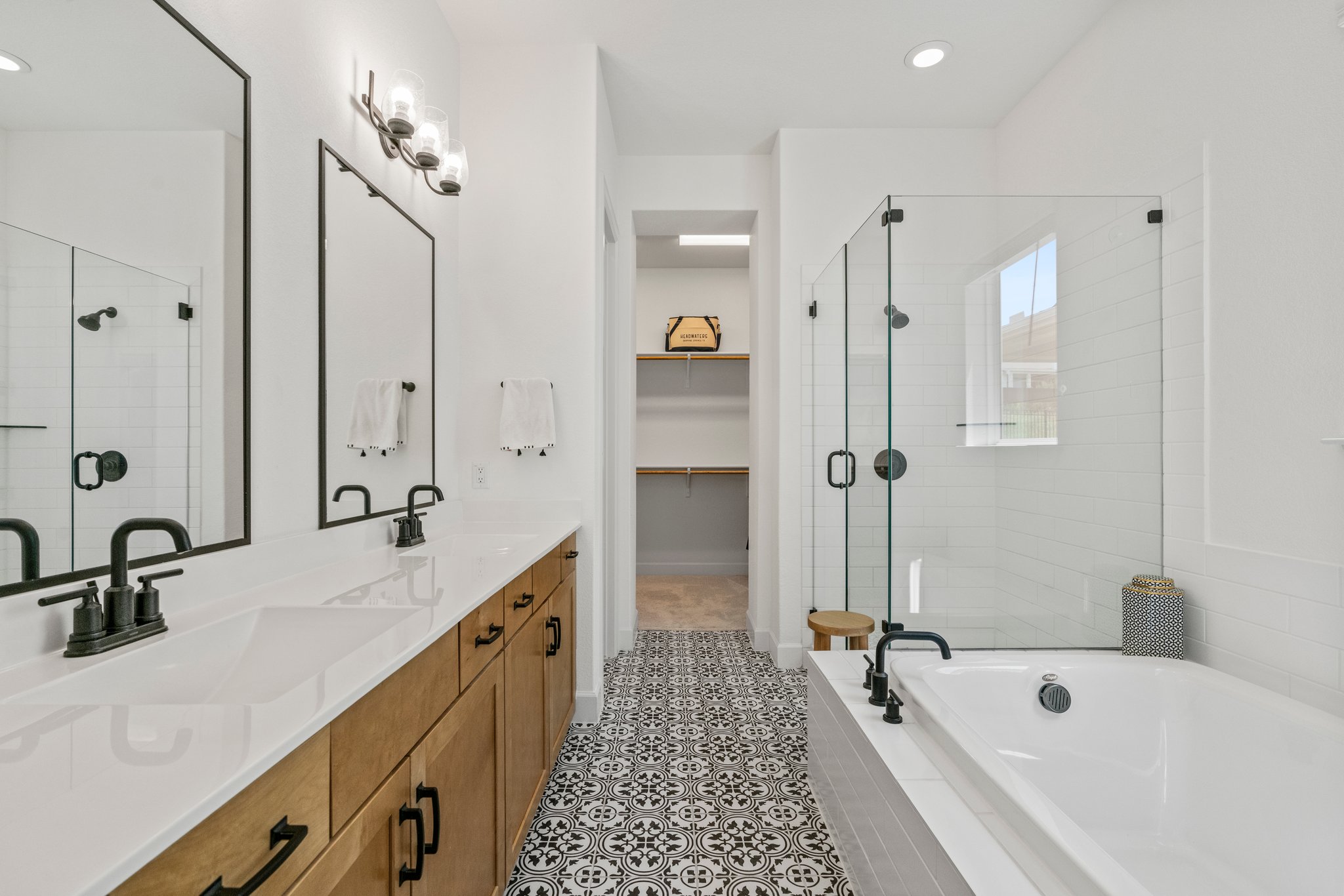 Dual sinks, soaking tub, glass enclosed shower