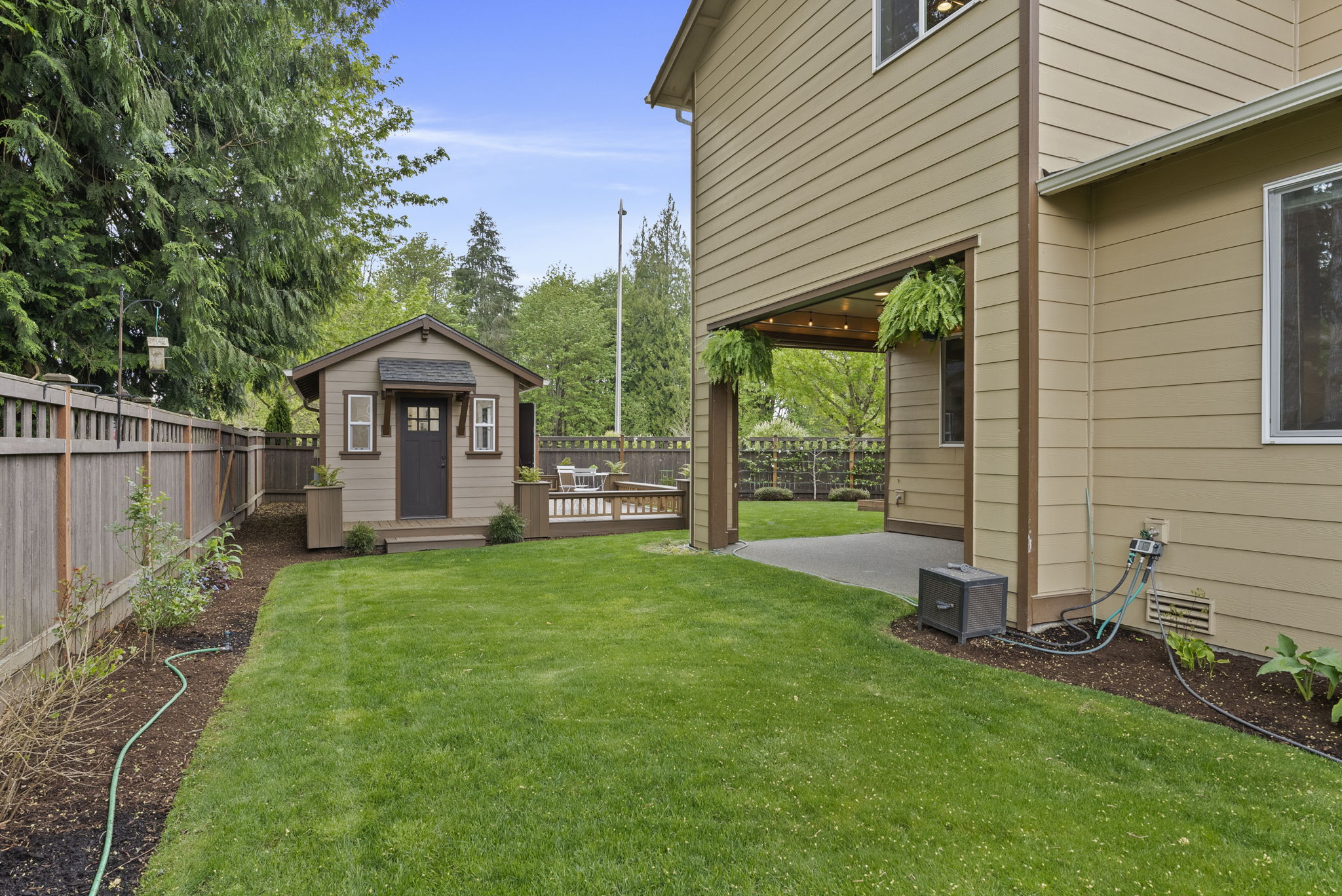Thoughtfully maintained backyard offering a high level of privacy