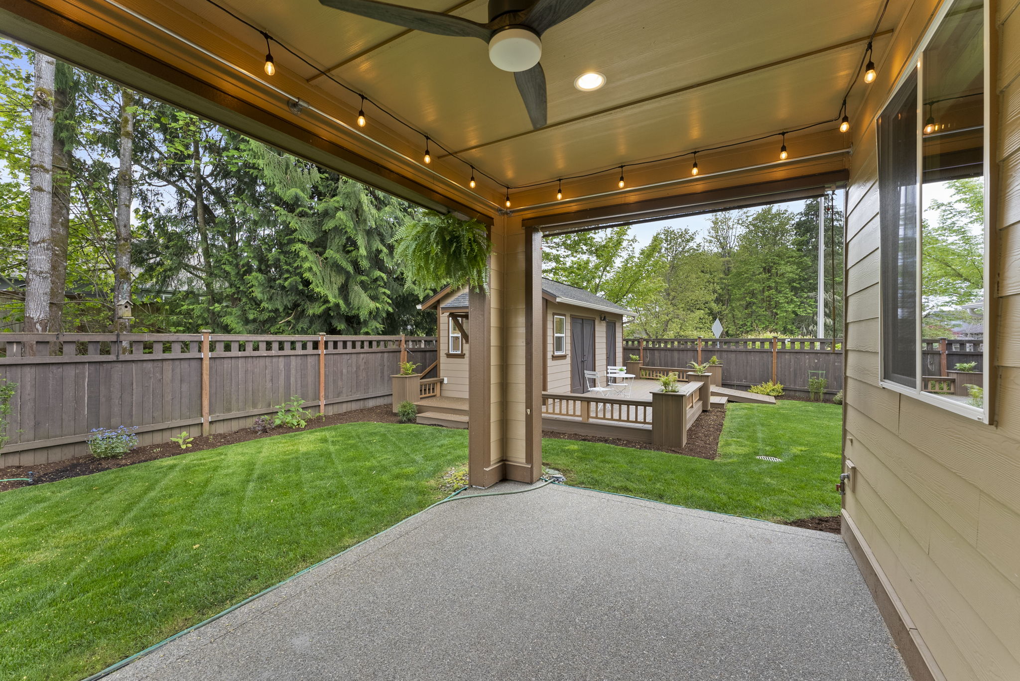 Beautiful covered back patio with shade-ready setup, backyard views, and gas stub for BBQ