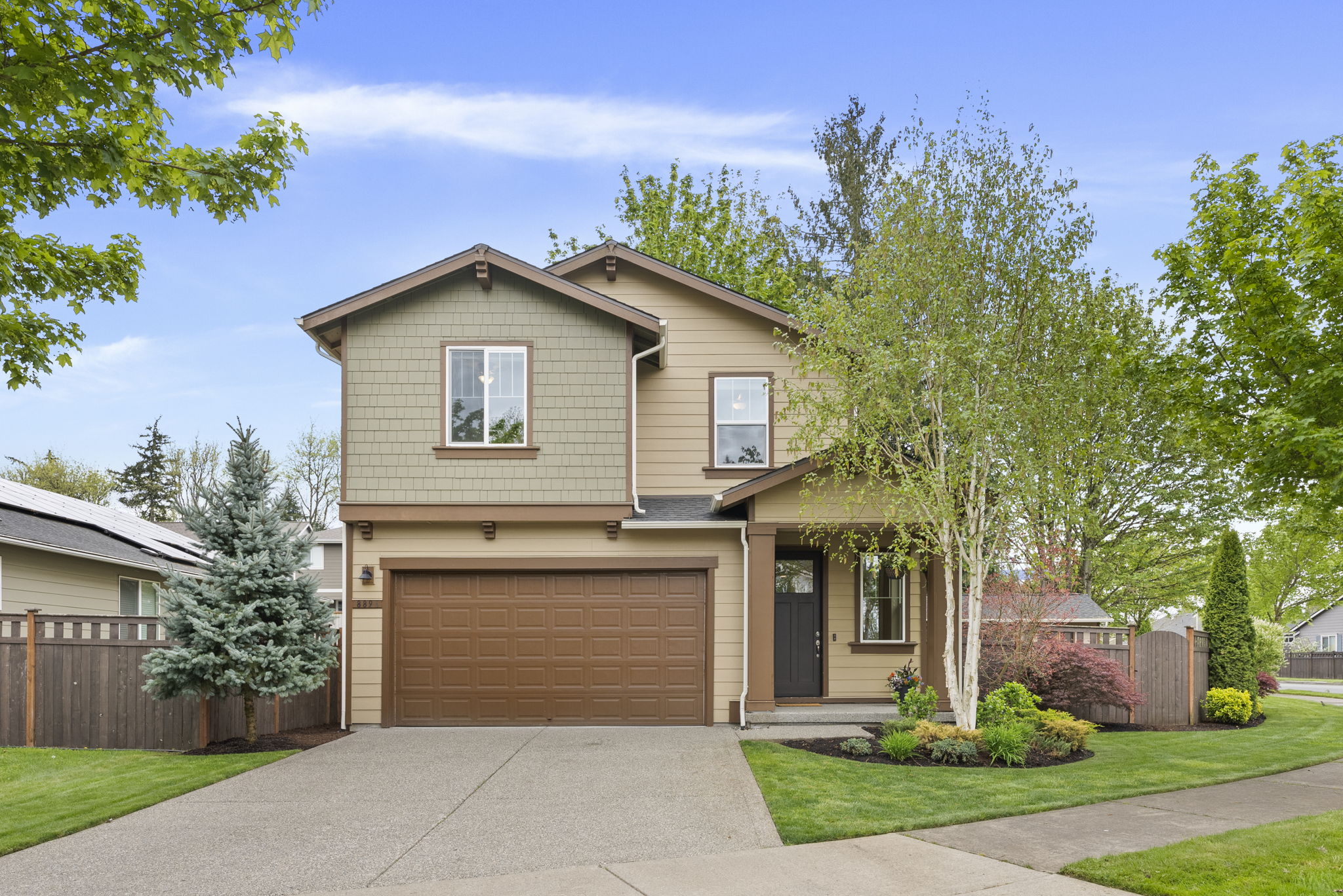 Thoughtfully landscaped front yard with built-in irrigation for easy maintenance