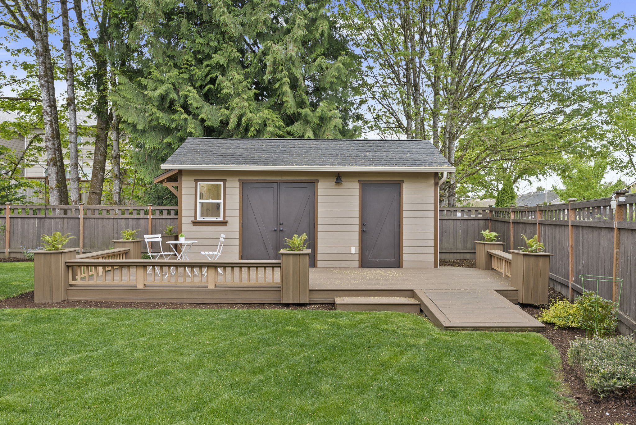 Workshop enhanced with low-maintenance Trex® decking and French doors for easy access