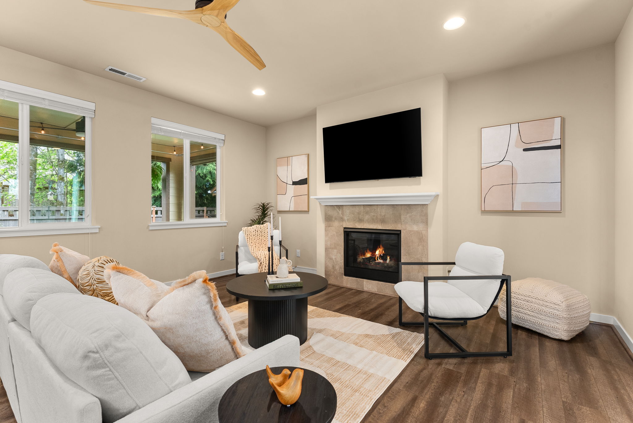 Cozy living space with gas fireplace, surround sound, and relaxing views of the backyard