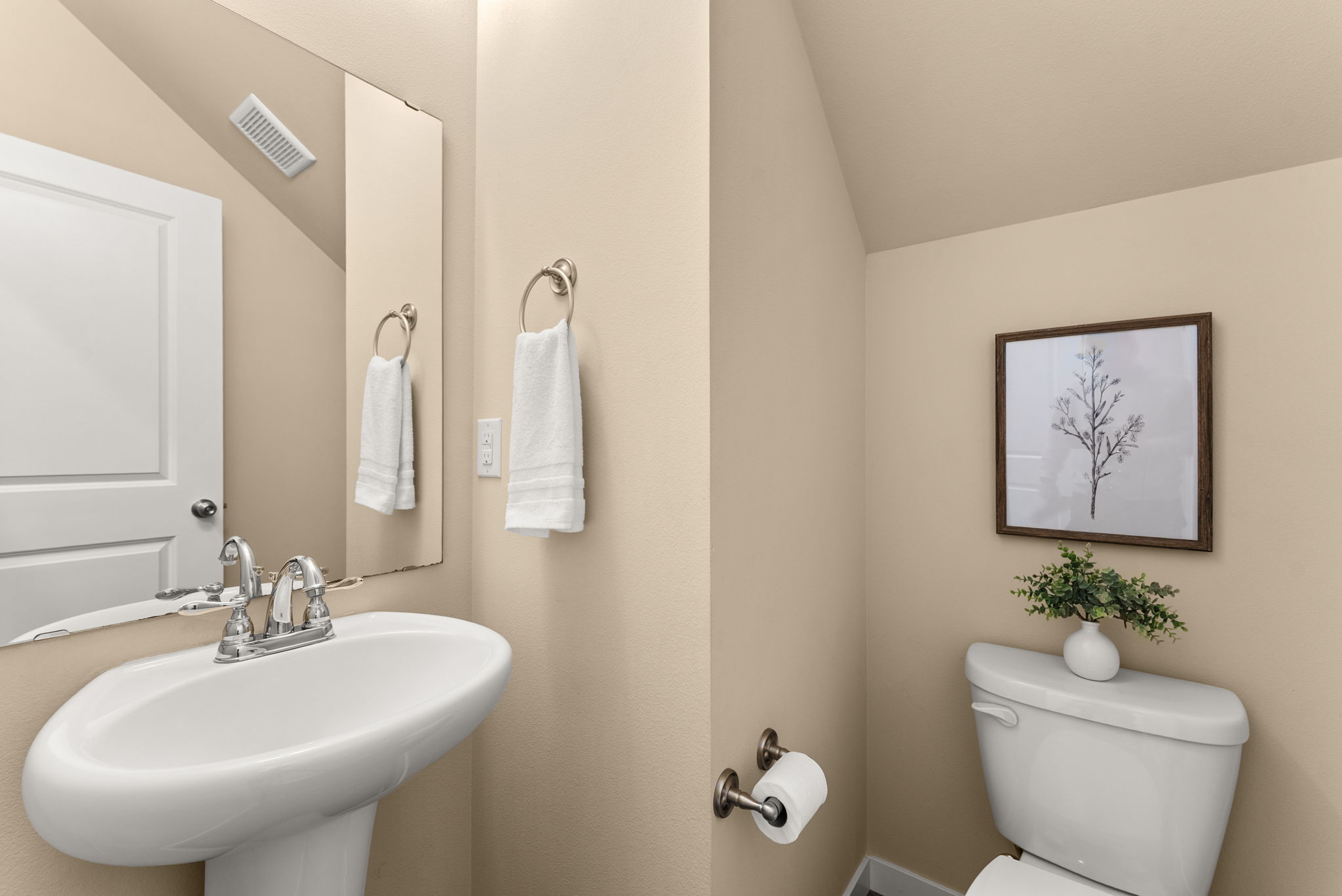 Powder room conveniently located off the kitchen