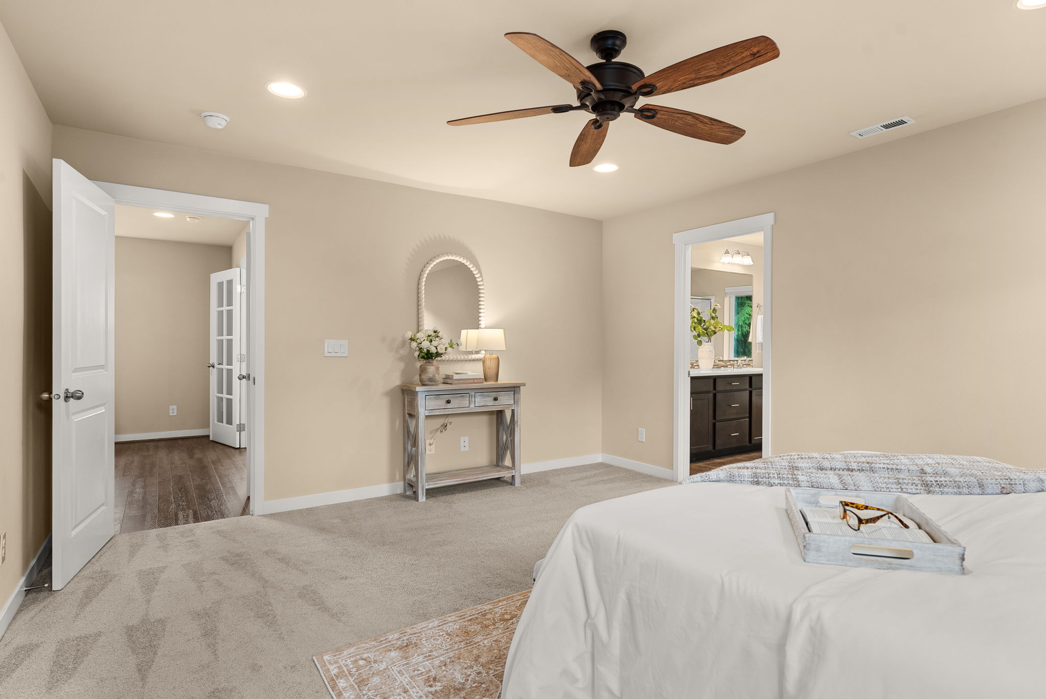 Primary bedroom with plush carpet for added comfort