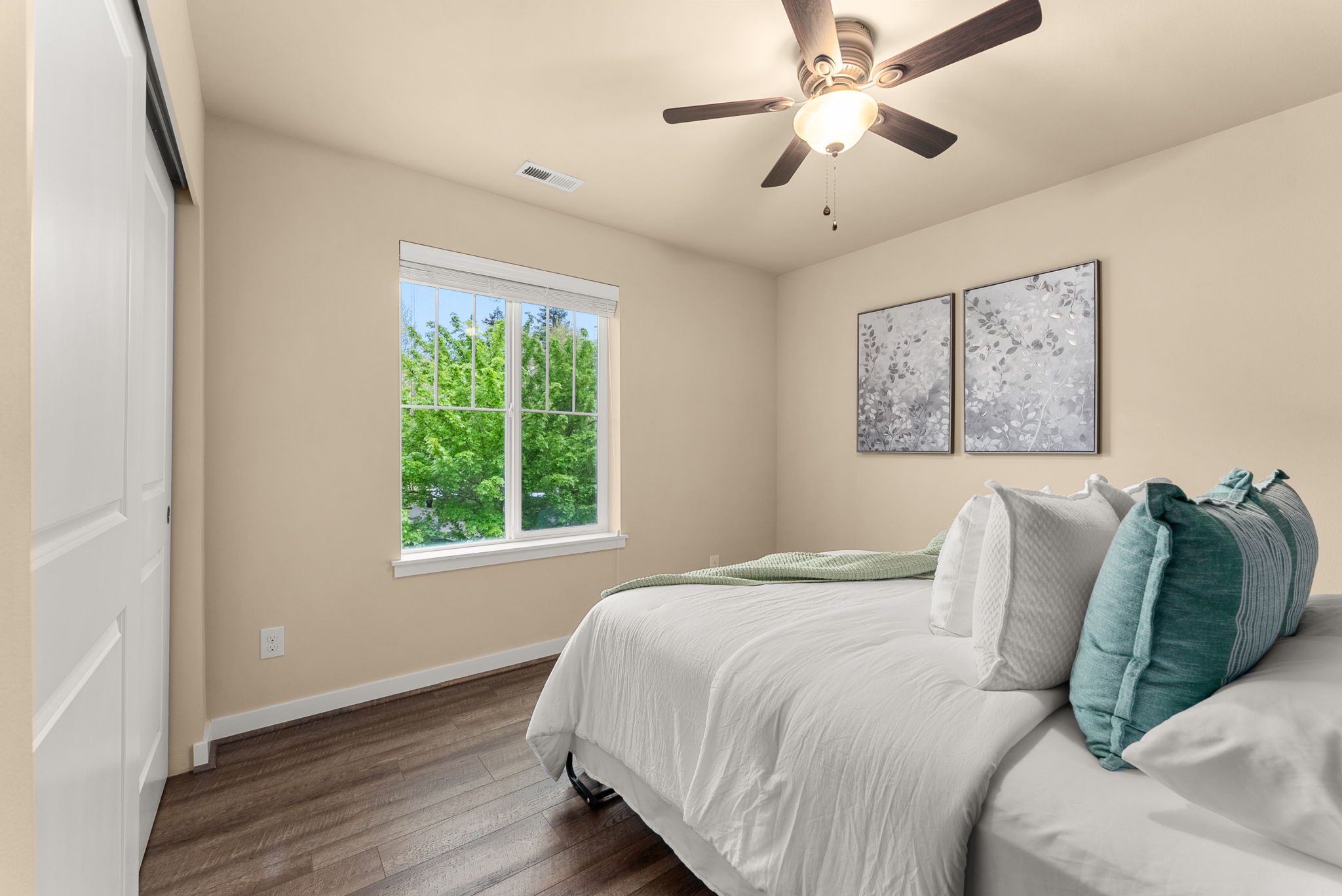 Additional guest bedroom featuring a beautiful Murphy bed (included) with front yard views