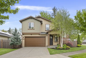 Thoughtfully landscaped front yard with built-in irrigation for easy maintenance