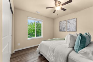 Additional guest bedroom featuring a beautiful Murphy bed (included) with front yard views