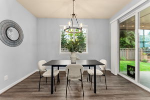 Generous dining area with ample natural light and scenic backyard views