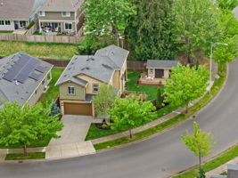 Welcome home, tucked on one of the larger corner lots in the community with a fully finished custom shop