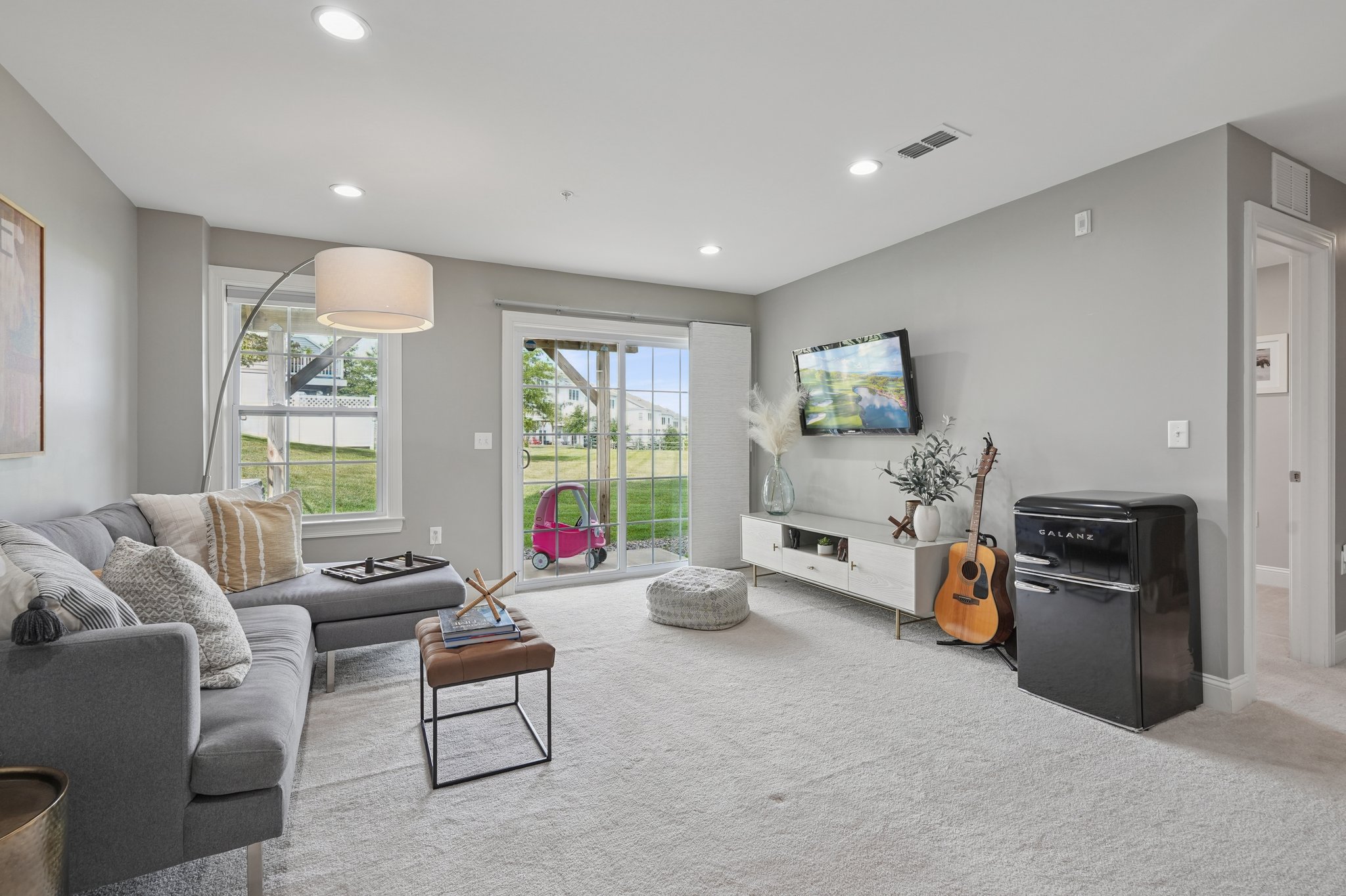 Three floors of flexible living. With outdoor access from both the main floor and lower level, this home lives larger.