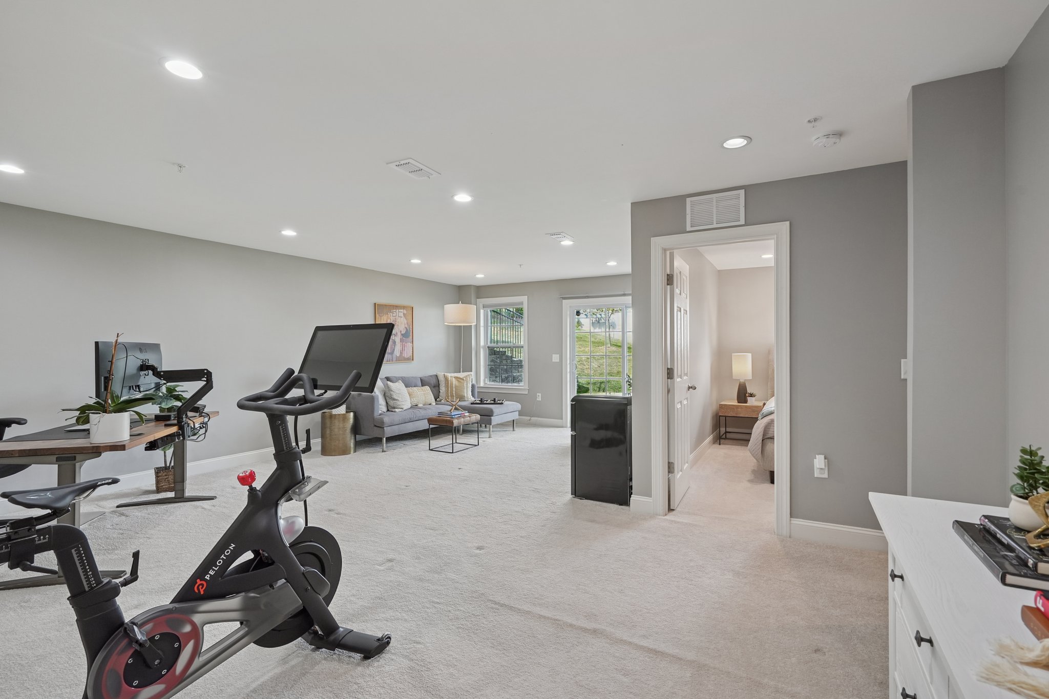 Space to stretch out. The expansive lower-level family room adapts for movies, fitness, or everyday play.
