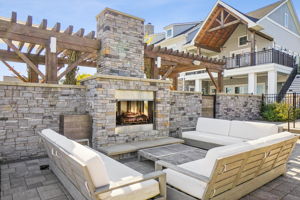 Inviting outdoor fireplace! Over 350 luxury units sprawl across woodlands and hills, built in phases since 2018. No more construction planned.