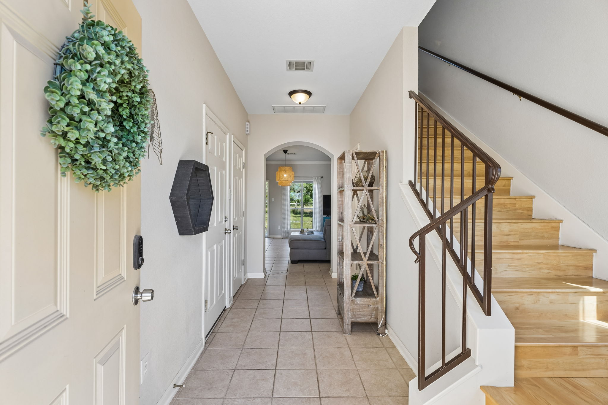 Foyer with access to the attached garage and coat closet.